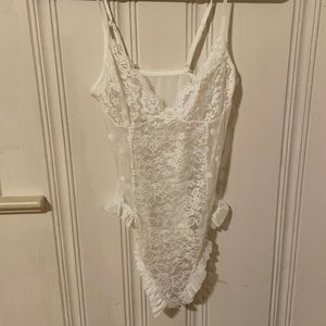 White lace lingerie bodysuit with pattern